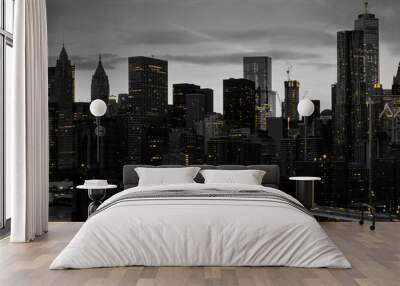 Yellow lights shining in black and white night time cityscape with the Brooklyn Bridge and buildings of Manhattan in New York City Wall mural